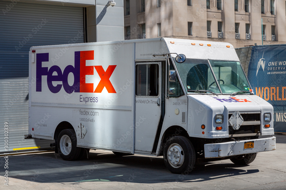 FedEx truck with a logo. FedEx is famous American multinational courier ...