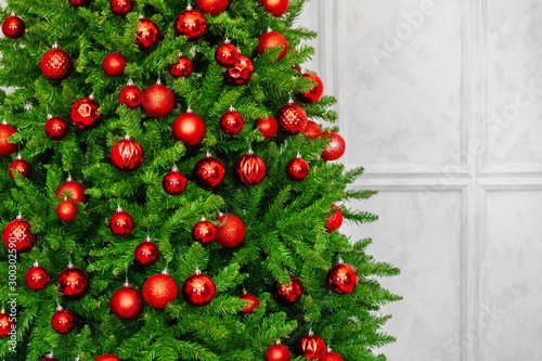 Beautiful Christmas tree with red baubles close up