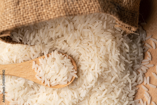 food background. thailand rice in a wooden spoon. soft focus