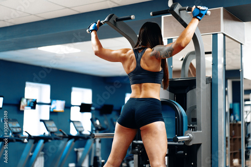 Sporty woman working out in a gym