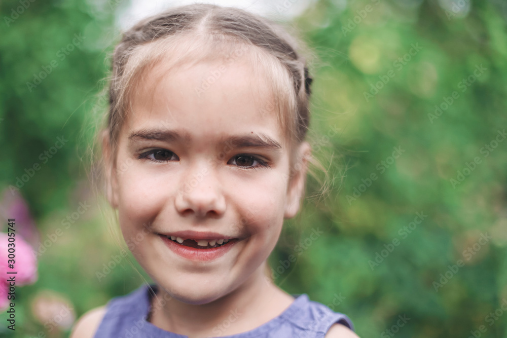 Adorable 6-7 years old girl with toothless smile Adorable 6-7 years old girl with toothless smile