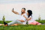 Middle age woman and man  taking a  selfie picture outdoor.- Concept  relations- Image
