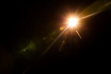 Abstract Natural Sun flare on the black background.