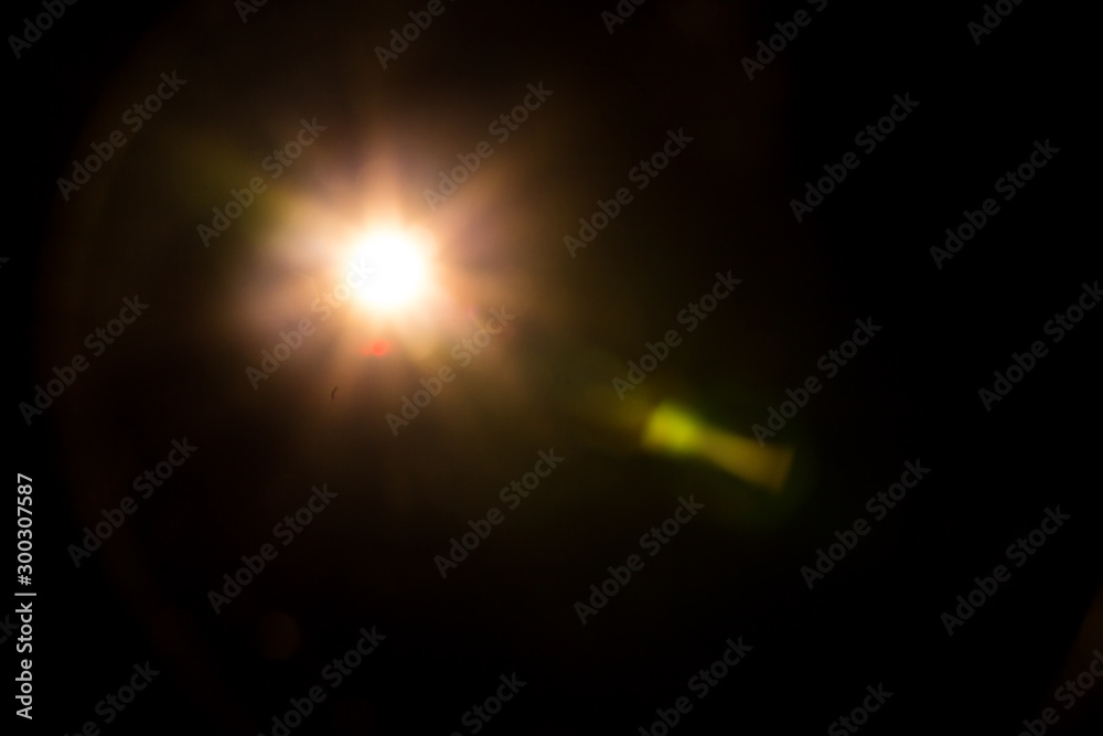 Fototapeta premium Abstract Natural Sun flare on the black background.