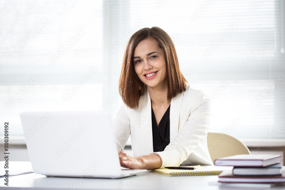 Young beautiful businesswoman with laptop Young beautiful businesswoman with laptop