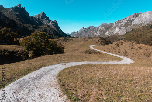 Gravel road to Lago del Valle lake in Somiedo Natural Park, Asturias, Spain photo