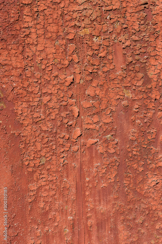 Old and peeling paint Over time, the red paint peeled off from the old boards and the wood texture cracked. Vintage Abstract Grunge Background Old and peeling paint Over time, the red paint peeled off from the old boards and the wood texture cracked. Vintage Abstract Grunge Background