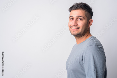 Closeup profile view of happy young Persian man smiling © Ranta Images