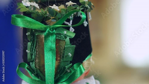 Doll dressed in a Sorbian costume and dress with colorful head piece representing the rich culture and tradition of the Slavic ethnic group in Lusatia in eastern Germany. photo