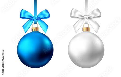 Realistic  blue, silver  Christmas  balls  with bow on white background.