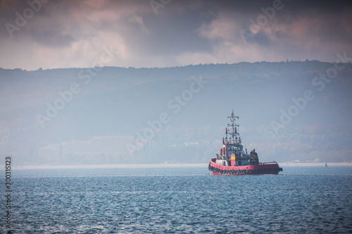 Patrol boat and sea port Varna, Bulgaria. Industrial cranes, ships and boats on the harbour © ValentinValkov