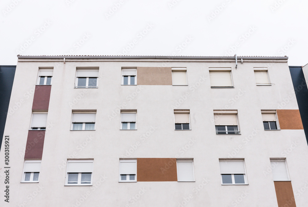 white facade with windows in residential building