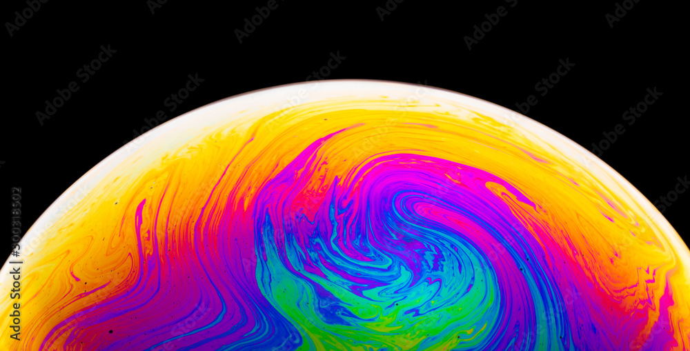 Rainbow soap bubble on a dark background. Close-up of colorful surface. - obrazy, fototapety, plakaty 