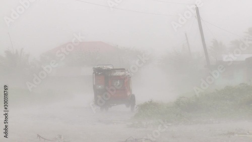 Hurricane Wind And Rain Batters Vehicle - Megi photo