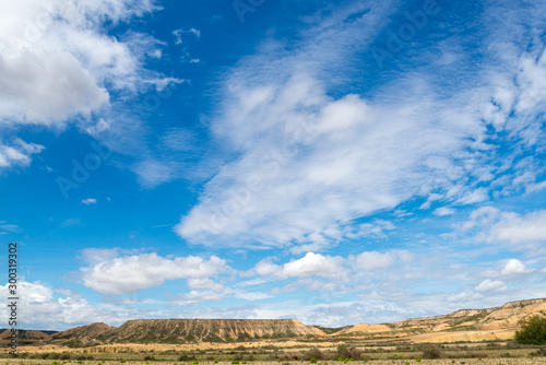 Spring sky with clouds above the badlands Bardenas Reales in the southeast of Navarre