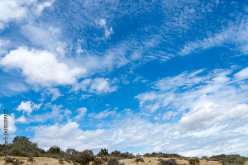 Spring sky with clouds above the badlands Bardenas Reales in the southeast of Navarre