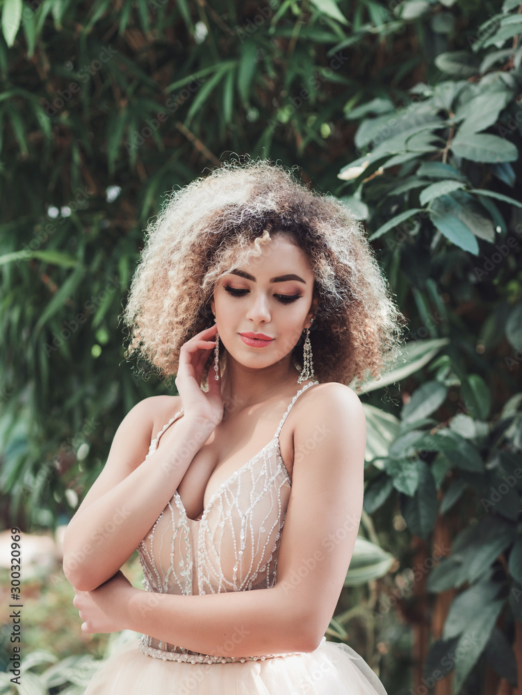 Portrait of young woman in wedding dress in the spring time. Portrait of young woman in wedding dress in the spring time.