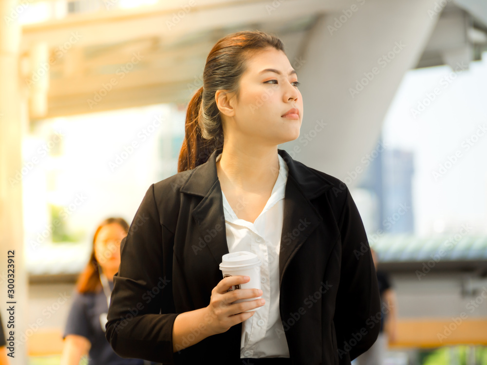 Close up portrait of a professional business woman smiling outdoor urban city downtown