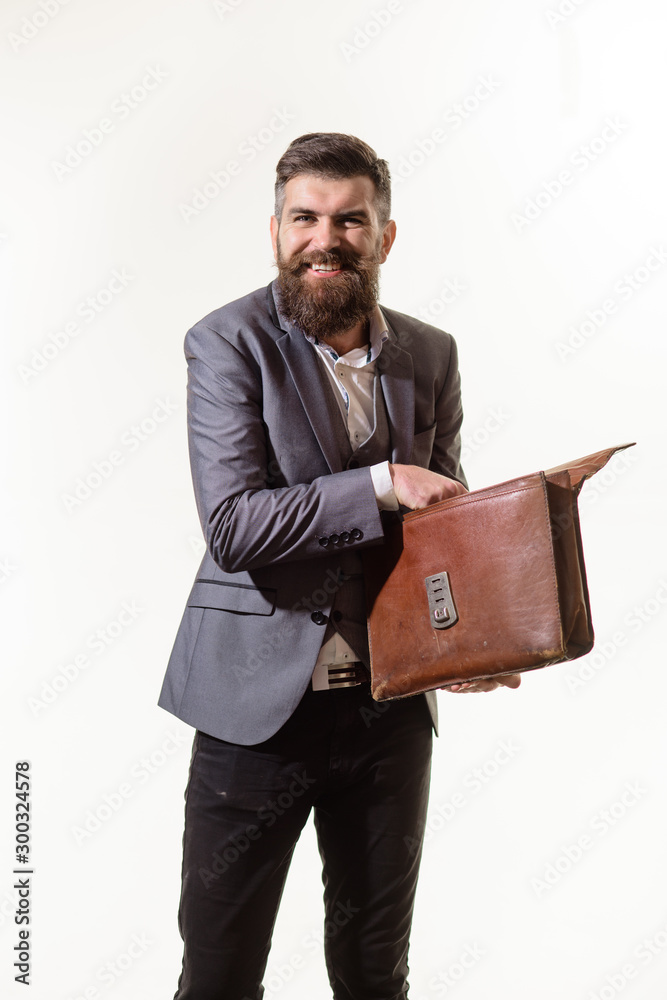 Elegant businessman in suit with briefcase. Businessman holds fashion men's leather briefcase. Business man in suit hold briefcase for documents. Fashionable man dressed in formal suit with briefcase. Elegant businessman in suit with briefcase. Businessman holds fashion men's leather briefcase. Business man in suit hold briefcase for documents. Fashionable man dressed in formal suit with briefcase.
