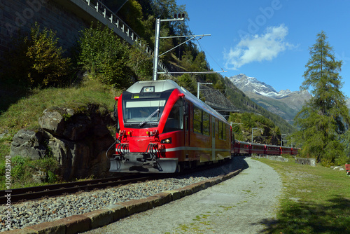 Bernina Express train in the mountains of Switzerlandm