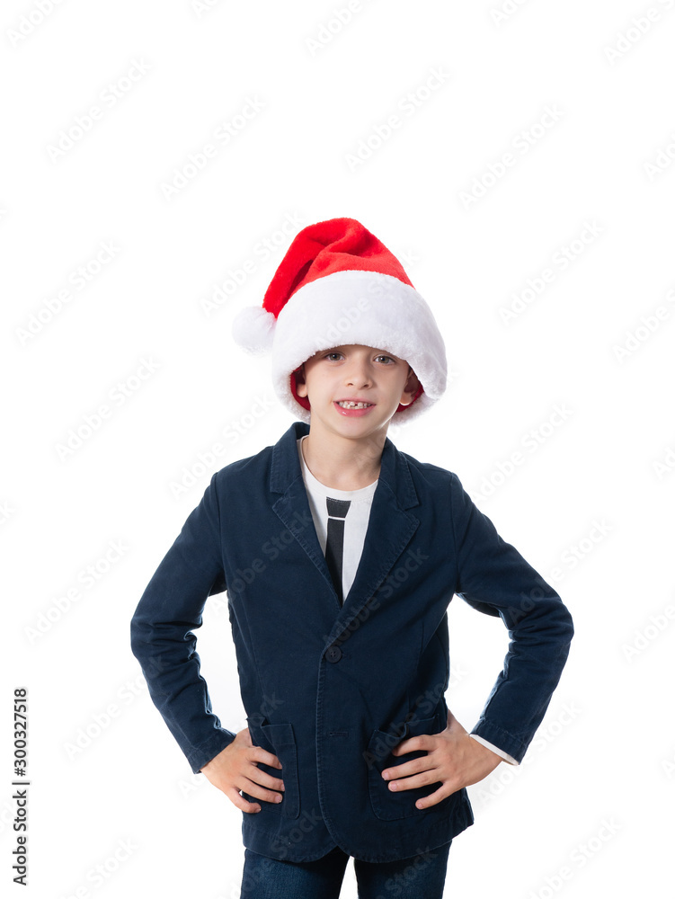 smart young boy with a Santa hat isolated on white background smart young boy with a Santa hat isolated on white background