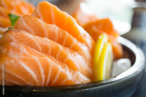 Salmon raw on a plate. Salmon sashimi.