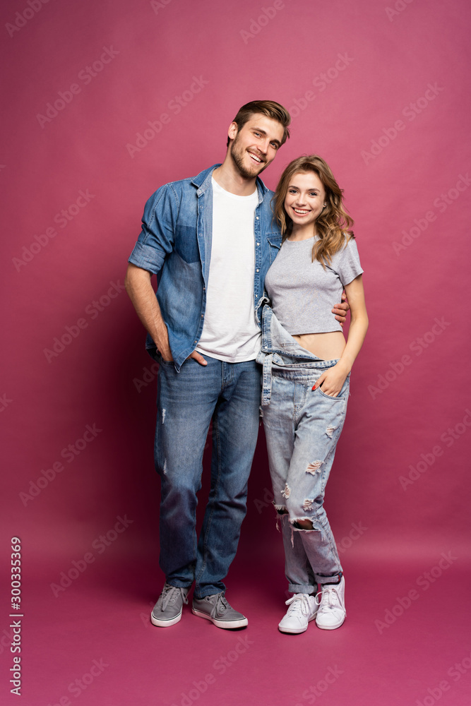 Happy loving couple isolated isolated on pink background. Happy loving couple isolated isolated on pink background.