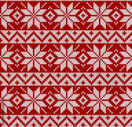 Seamless knitted red pattern. Christmas backgroung