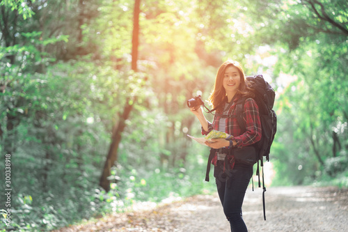 Photography Asian tourist  woman travel with map in forest