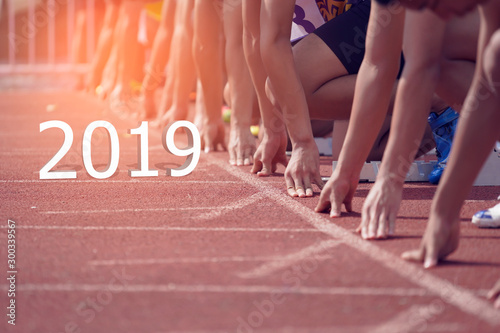 2019 Happy New year Concept. Side view of a Sport Man on Start line, Get Ready for New Challenge