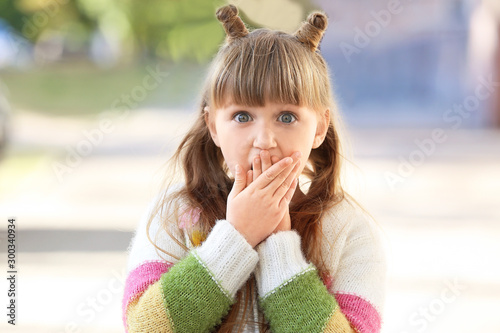 Surprised little girl walki...