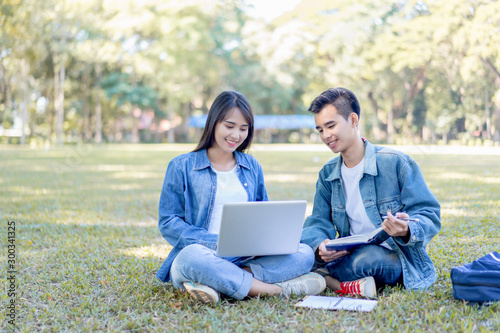 Photography Education study abroad, group of Asian student boy with book and girl sitting at