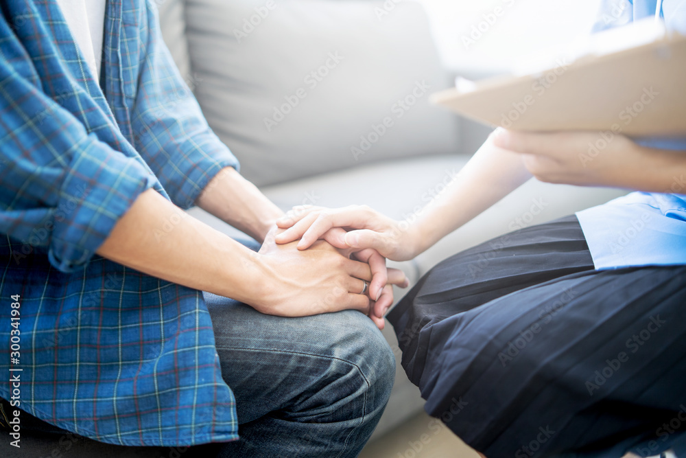 Fototapeta premium Asian female Doctor and patient are discussing something about medicine ,Having Consultation,Medical physician working in hospital writing a prescription, Healthcare ,medically concept,selective focus