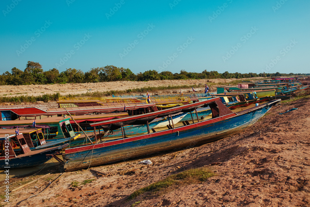 Floating Village Boats on the river in Cambodia near Pean Bang and Tonle Sap Lake
