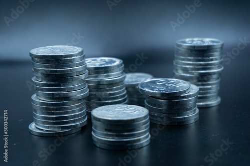 Close up of coins to stack of coins, Business Growth concept, There is money coins to stack of coins. Financial risk.