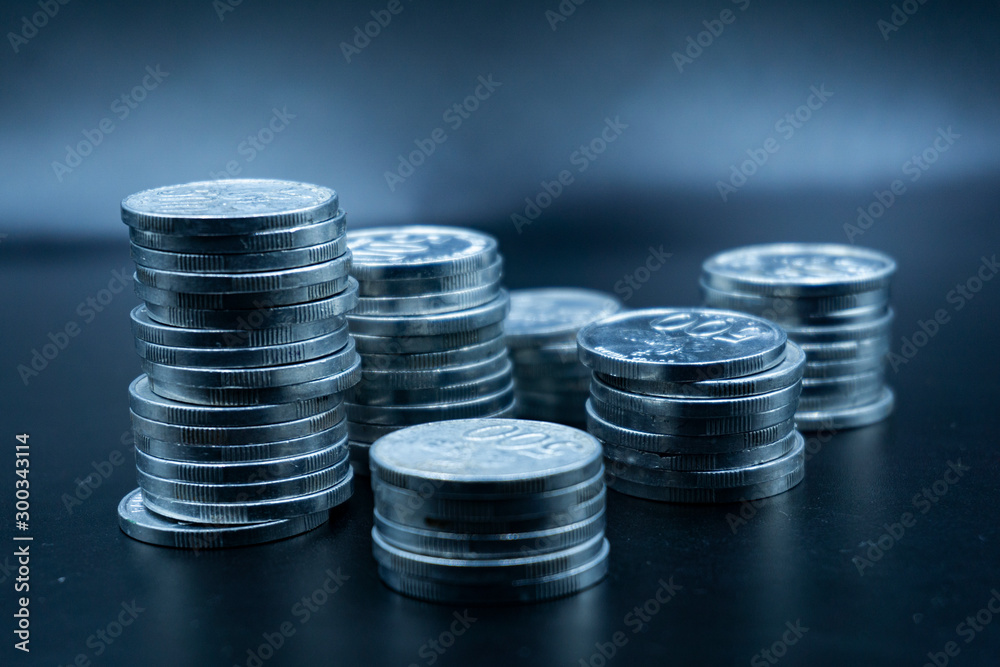 Close up of coins to stack of coins, Business Growth concept, There is money coins to stack of coins. Financial risk. Close up of coins to stack of coins, Business Growth concept, There is money coins to stack of coins. Financial risk.