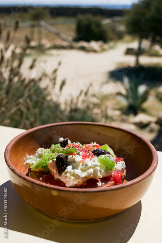 Obraz na plátně Dakos greek appetizer, dried bread, tomatoes, feta, or mizithra cheese, capers, oregano