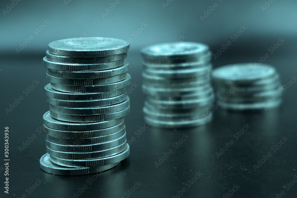 Close up of coins to stack of coins, Business Growth concept, There is money coins to stack of coins. Financial risk. Close up of coins to stack of coins, Business Growth concept, There is money coins to stack of coins. Financial risk.