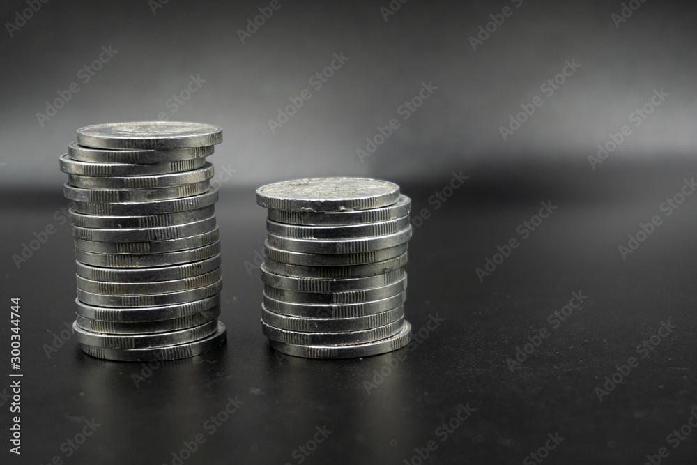 Close up of coins to stack of coins, Business Growth concept, There is money coins to stack of coins. Financial risk. Close up of coins to stack of coins, Business Growth concept, There is money coins to stack of coins. Financial risk.