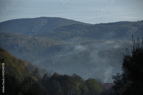 autumn mountains with haze of rising clouds