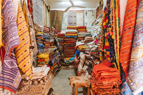 Textile shop in a moroccan market, with carpets in a lot of colors.
