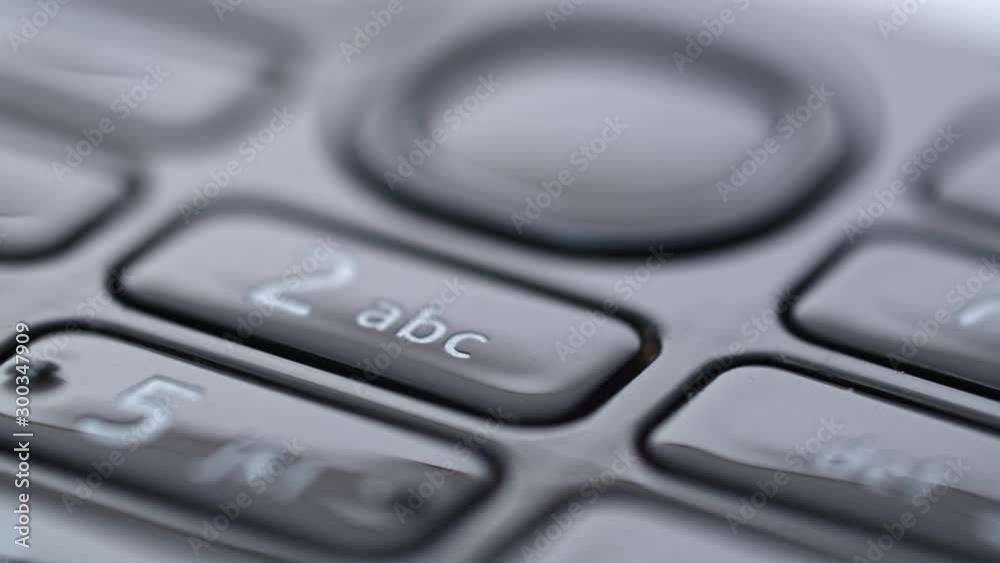 Dial button panel of a old school era cellphone, sliding macro closeup Dial button panel of a old school era cellphone, sliding macro closeup