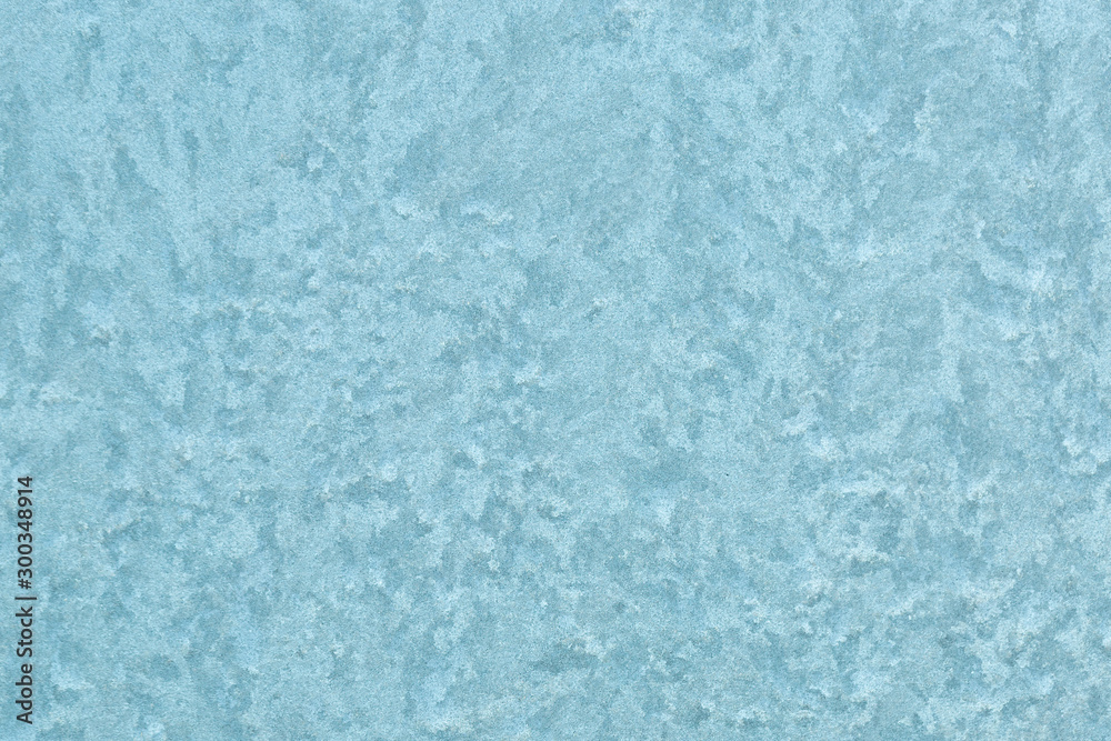 Frost patterns on window. Blue Frost Background. Closeup Frozen Winter Window. Extreme low temperature. Frost patterns on window. Blue Frost Background. Closeup Frozen Winter Window. Extreme low temperature.