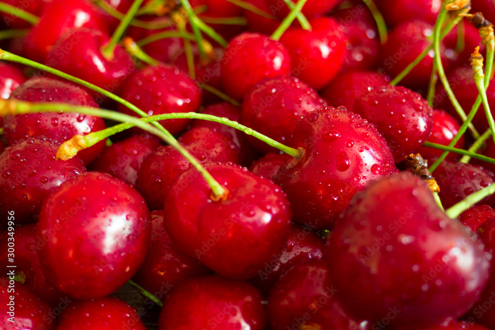 Background of juicy fresh red cherry berries with water droplets Background of juicy fresh red cherry berries with water droplets
