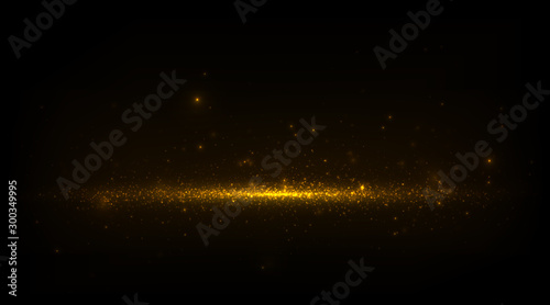 Abstract luxury background with sparkling golden dust and glowing particles