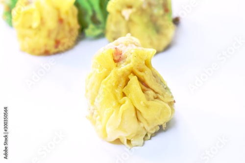steamed Chinese dumpling filling minced pork or dim sum on white background