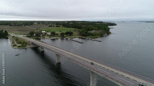 Wallpaper Mural Aerial view of Scandinavian landscape and bridge. Group of motorcyclist riding through the long modern bridge.  Torontodigital.ca
