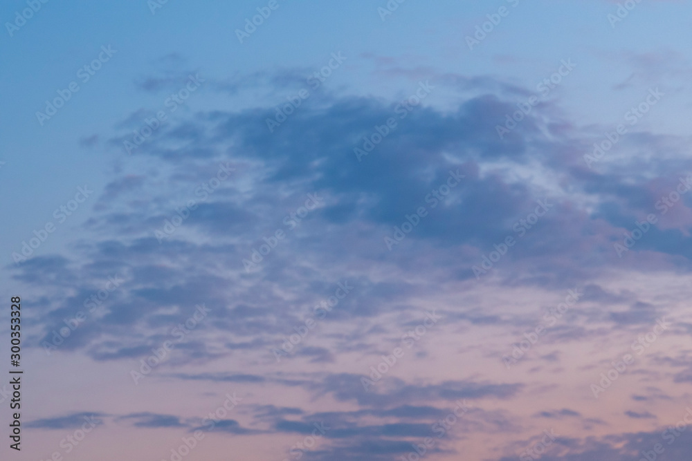 Sunset sky with soft gray clouds. Cloudscape for background..