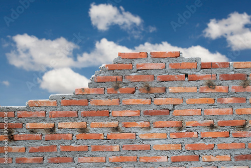 old brick wall with cloud and blue sky