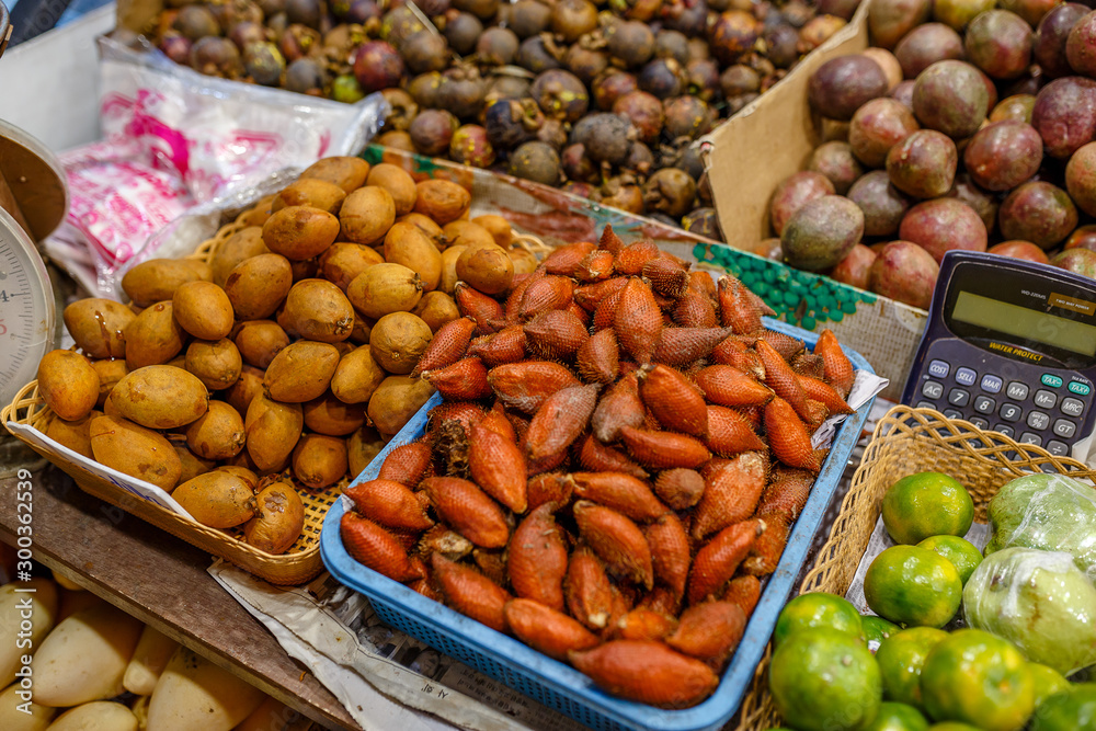 Traditional asian food market in Thailand, exotic fruits